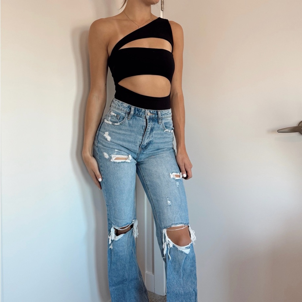 Stylish Black Cutout Top with Distressed Blue Jeans